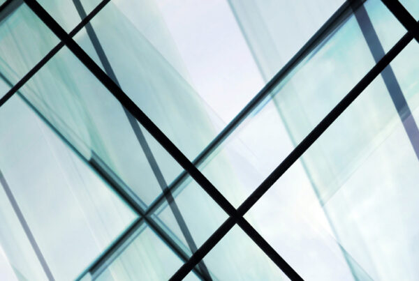 High-rise glass architecture. Contemporary office building / modern interior design with glazed aluminum structures.